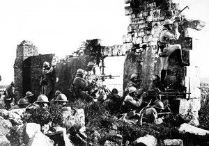 French troopers under General Gouraud, with their machine guns amongst the ruins of a cathedral near the Marne, driving back the Germans. 1918. Central News Photo Service. (War Dept.) Exact Date Shot Unknown NARA FILE #: 165-WW-286-36 WAR & CONFLICT BOOK #: 619